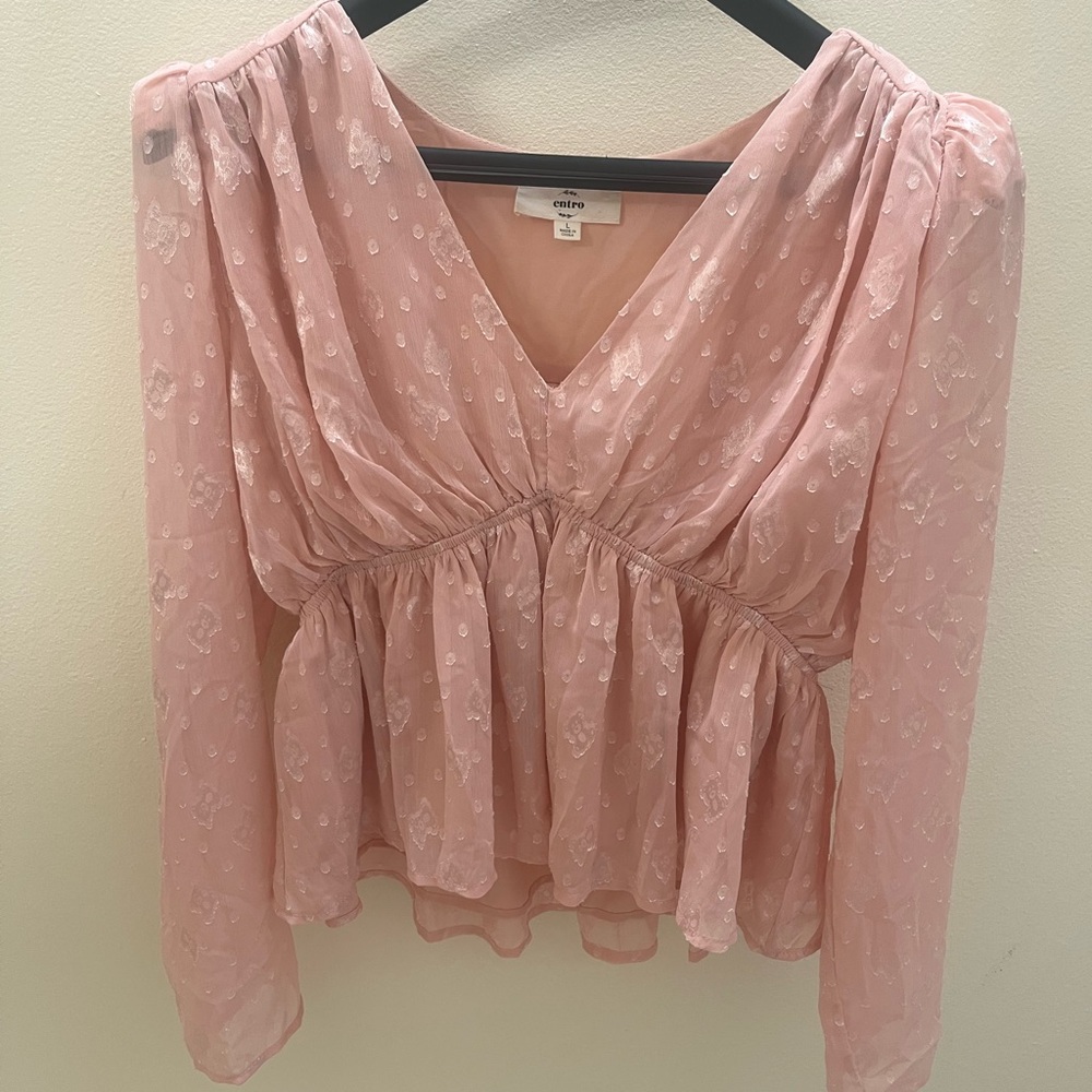 pink flowy blouse slightly cropped